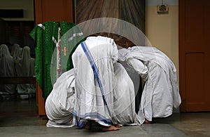 Sisters of Missionaries of Charity preparing for prayer in Motherhouse, Kolkata