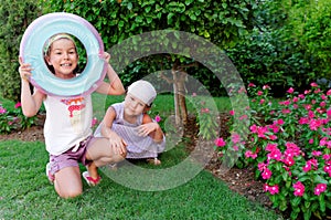 Sisters playing in garden