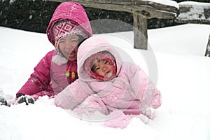 Sisters playing in the snow