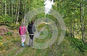 Sisters walking in forest