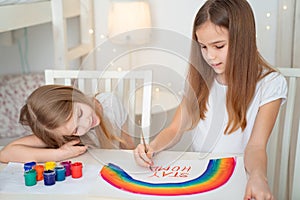 Sisters write stay at home. flashmob. rainbow. photo