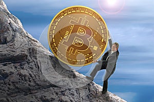 Sisyphus concept showing man struggling to push giant Bitcoin up a mountain representing goal of mining and getting rich