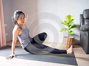 Sit Through bodyweight pose asian woman home workout fitness body weight exercise health training sport healthy lifestyle activity