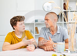 Sit-down conversation of dad and son