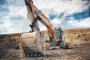 site excavator. details of roadworks with heavy duty machinery photo