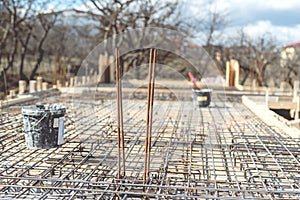 Site of new building, details and reinforcements with steel bars and wire rod, preparing for cement pouring