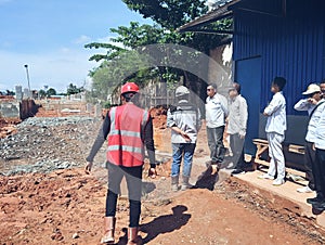 On-Site Safety Briefing with Field Workers and Supervisors