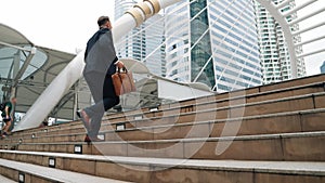 Site view of caucasian businessman walking up stairs. Finding a job. Urbane.