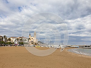 Sitges empty Fragata beach at cloudy day, no people photo