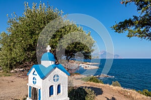 Sithonia - Miniature traditional greek church with scenic view of holy Mount Ahtos near Sarti harbour, peninsula Sithonia,