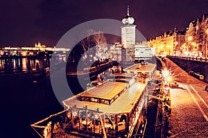 Sitkov water tower and boat restaurant in Prague, Czech republic. Night scene. Travel destination. Red photo filter