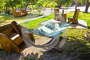 The sitting area with hammock at sunny day on beach in Haiti