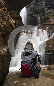 Bushwalker in awe of the waterfalls photo