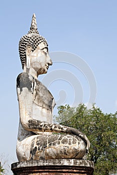 Sitting Buddha against Blue Sky