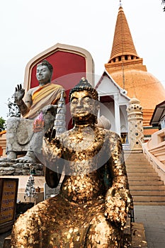 Sitting Buddha statue in Thai Buddhist Temple, the tallest and biggest stupa, pagoda in the world.