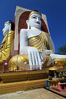 Sitting Buddha statues at the Kyaik Pun Pagoda in Bago