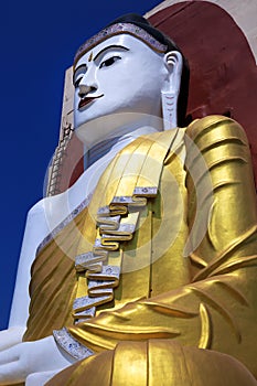 Sitting Buddha statues at the Kyaik Pun Pagoda in Bago