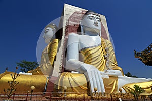 Sitting Buddha statues at the Kyaik Pun Pagoda in Bago