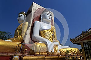 Sitting Buddha statues at the Kyaik Pun Pagoda in Bago