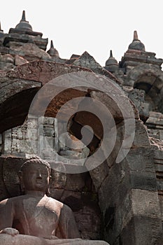 Sitting Buddha in stone at Borobudur