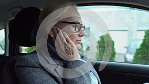 Sitting in car woman feeling acute pain, inflammation of inner ear, eardrum