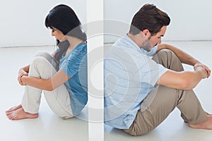 Sitting couple are separated by white wall