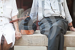 Sitting elderly couple on bench