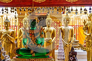 Sitting Emerald Buddha golden statue in thai Doi Suthep temple