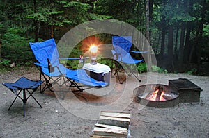 Sitting by the fire at a campsite