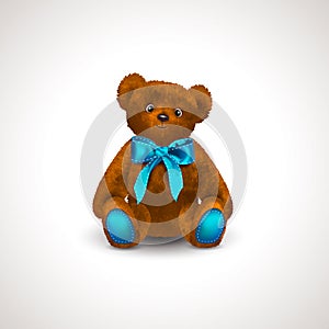 Sitting fluffy cute red brown or rufous teddy bear toy with bright blue ribbon or bow. Children`s toy isolated on white backgroun