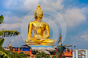 Sitting golden big Buddha statue at Golden Triangle