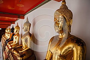 Sitting Golden Buddhas in Wat Pho temple in Bangkok