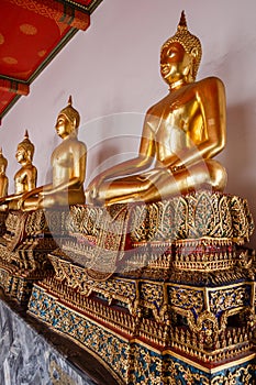 Sitting Golden Buddhas in Wat Pho temple in Bangkok