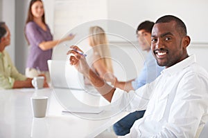 Sitting through an informal meeting. Businesspeople listening to a presentation.