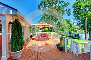 Sitting room area on spacious walkout deck overlooking water view.