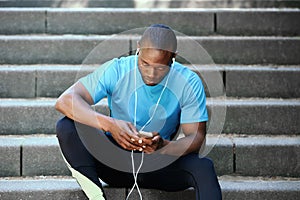 Sitting on steps listening to music with mobile phone