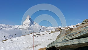 Sitting on stones in Matterhorn Mountain in Swiss
