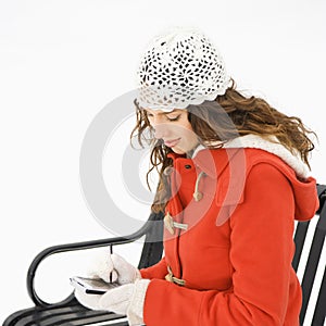 Sitting woman with PDA.