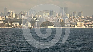 Sityscape from Bosphorus strait to the modern distruct of Istanbul with skyscrapers, Turkey. Video in 4K UHD, 3840