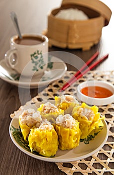 Siu Mai - Chinese steamed pork dumplings in bamboo steamers. Dim Sum