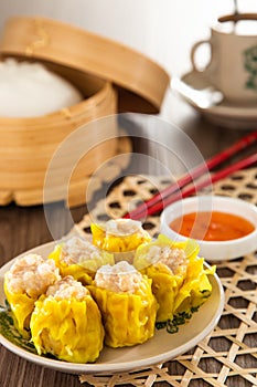 Siu Mai - Chinese steamed pork dumplings in bamboo steamers. Dim Sum