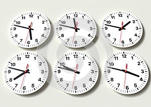 Six analog clocks on wall, showing world time