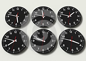 Six analog clocks on wall, showing world time