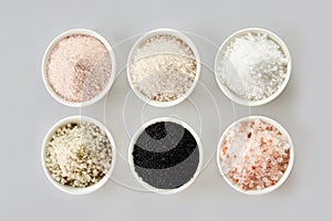 Six assorted gourmet salts in bowls