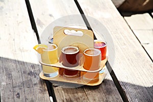 Six Beer Samples in the Sunshine on a Picnic table