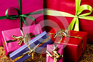 Six Bows Tied around Unicolored Gift Boxes