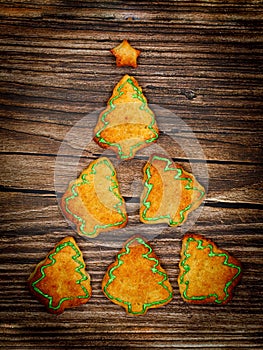 Six Christmas trees made of cookies in shape of Christmas tree with star