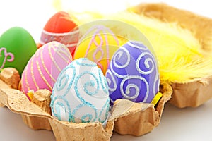 Six colorful easter eggs in box