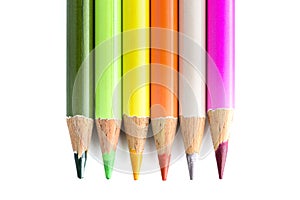 Six coloured pencils on white