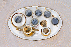 Six Cups of Turkish Coffee Served on White Table